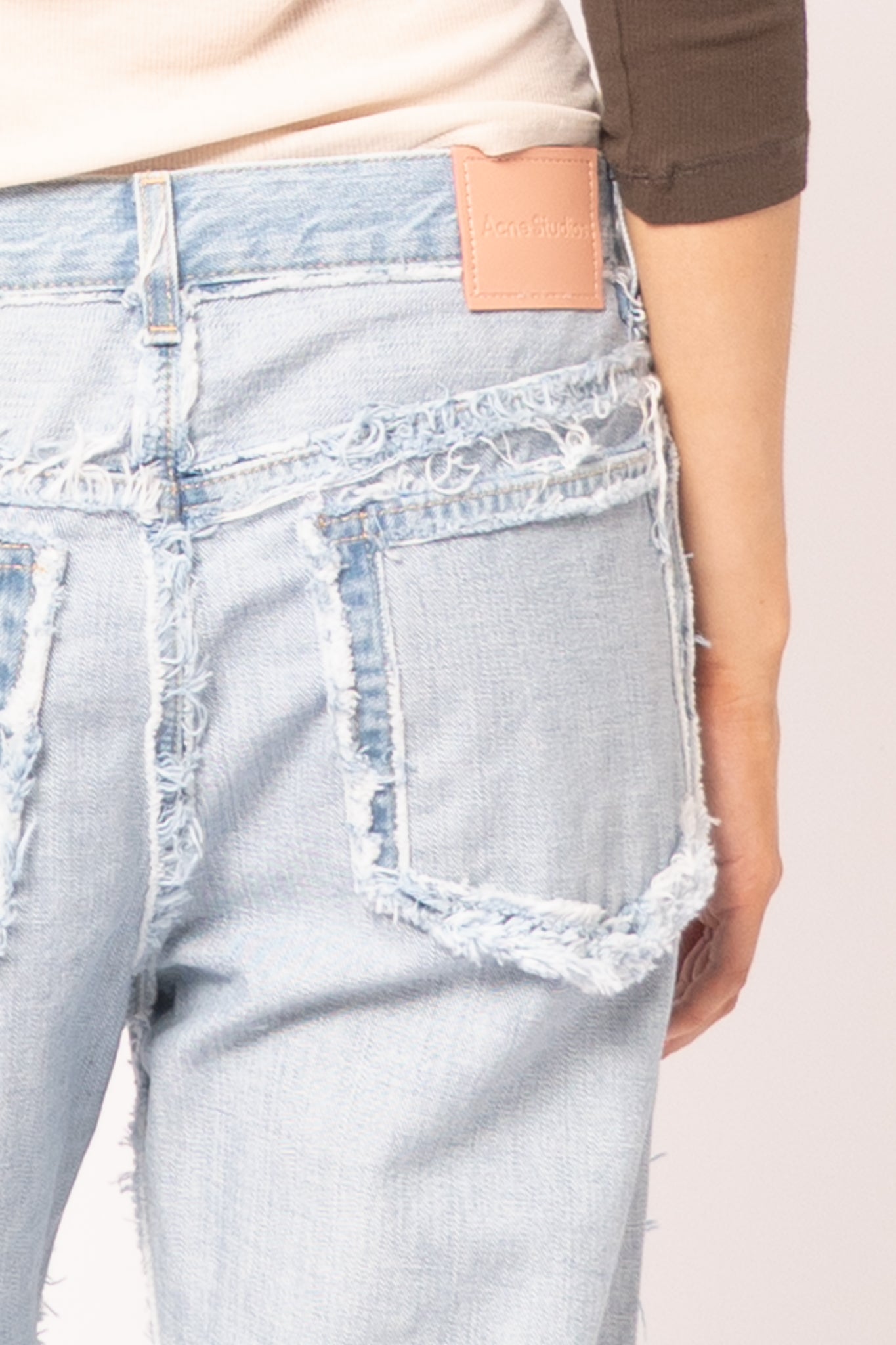Frayed Light Blue Denim Jeans